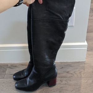 Knee high black leather heels
